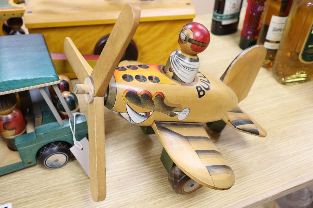 A collection of hand-crafted painted wooden toys, 1980s,